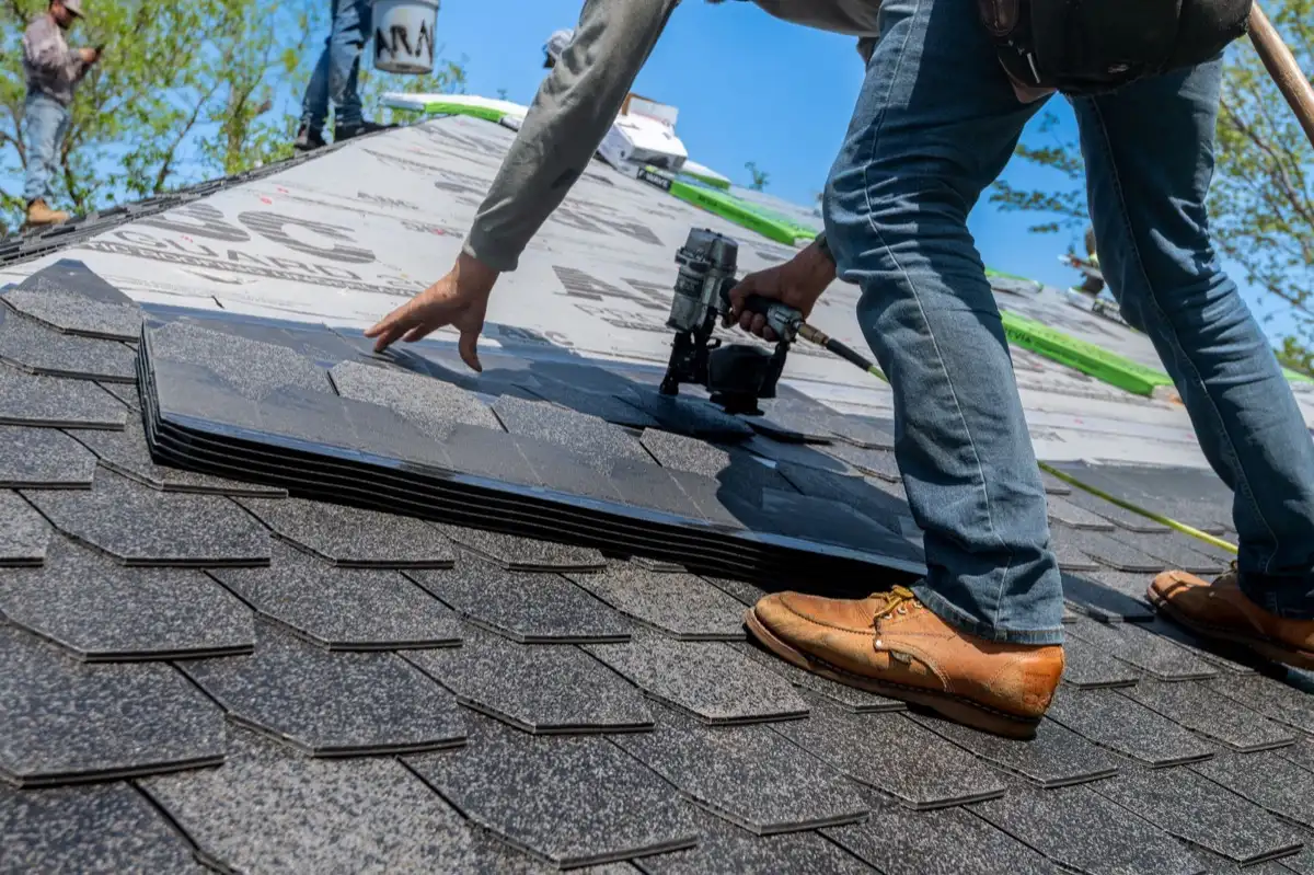 Inspecting an asphalt shingle slope after a hailstorm in New Braunfels, TX